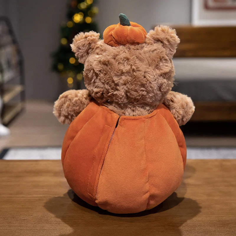 Adorable plush toy featuring a cute bear nestled inside a vibrant pumpkin, perfect for adding a cozy, festive touch to your Halloween decor.