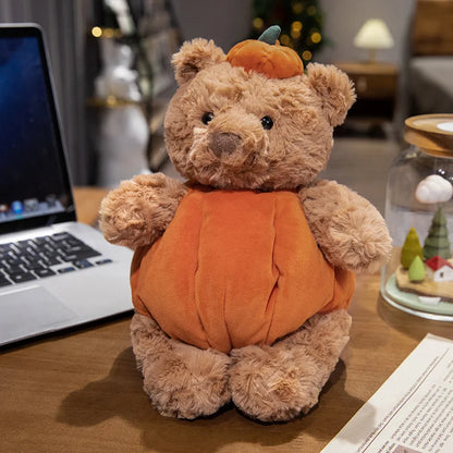 Adorable plush toy featuring a cute bear nestled inside a vibrant pumpkin, perfect for adding a cozy, festive touch to your Halloween decor