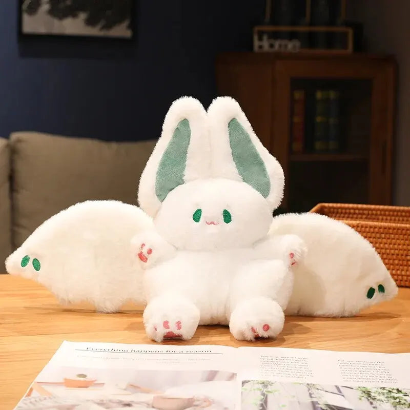 Adorable plush white bat with soft fabric and oversized ears, perfect for cuddling and adding a charming touch to your Halloween decor