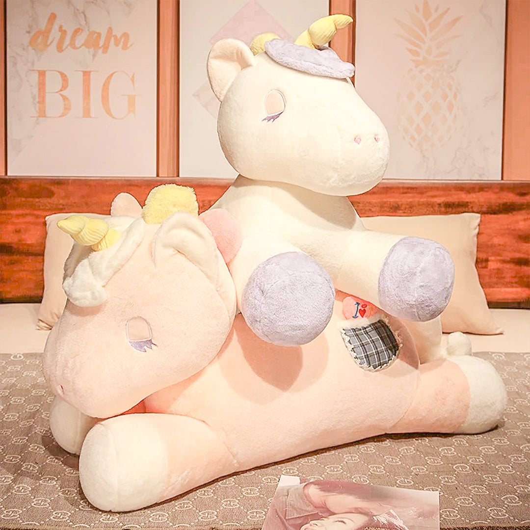 A gigantic unicorn plush toy with a sparkling horn and rainbow mane, ready to fill your room with magic and joy