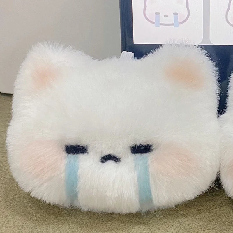 Soft and fluffy crying and grumpy cat plush keychains attached to a bag, ideal kawaii accessories