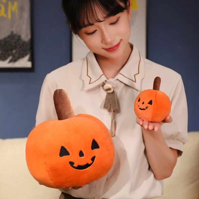 Adorable pumpkin-shaped plush toy featuring a smiling face, ideal for adding a festive touch to your Halloween decor