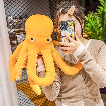 Charming octopus plush toy featuring soft fabric and wiggly tentacles, offering the ultimate cuddle experience for all ages