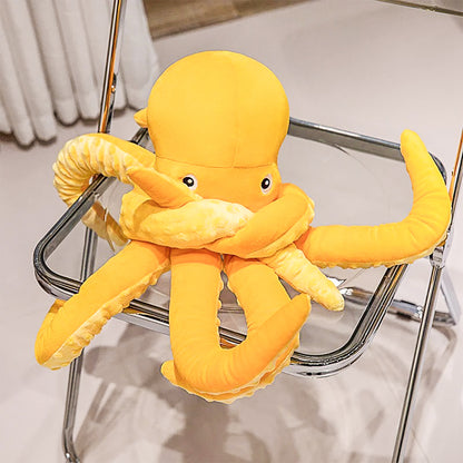 Charming octopus plush toy featuring soft fabric and wiggly tentacles, offering the ultimate cuddle experience for all ages