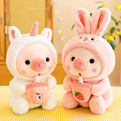 Adorable piglet plush toy with a boba tea design, on the left the cute baby pig plush toy dressed as a unicorn and pink one on the right!